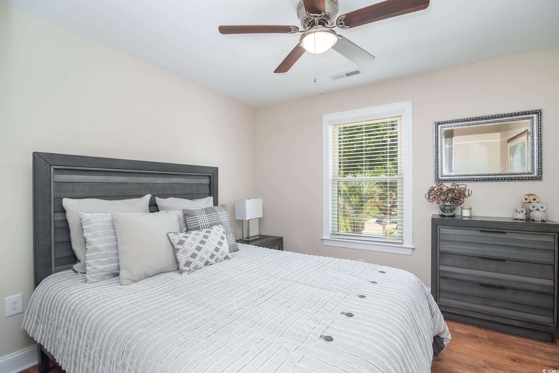 193 Field Loop Road Georgetown, SC 29440 - Photo 22 of 40 Bedroom with wood finished floors and ceiling fan