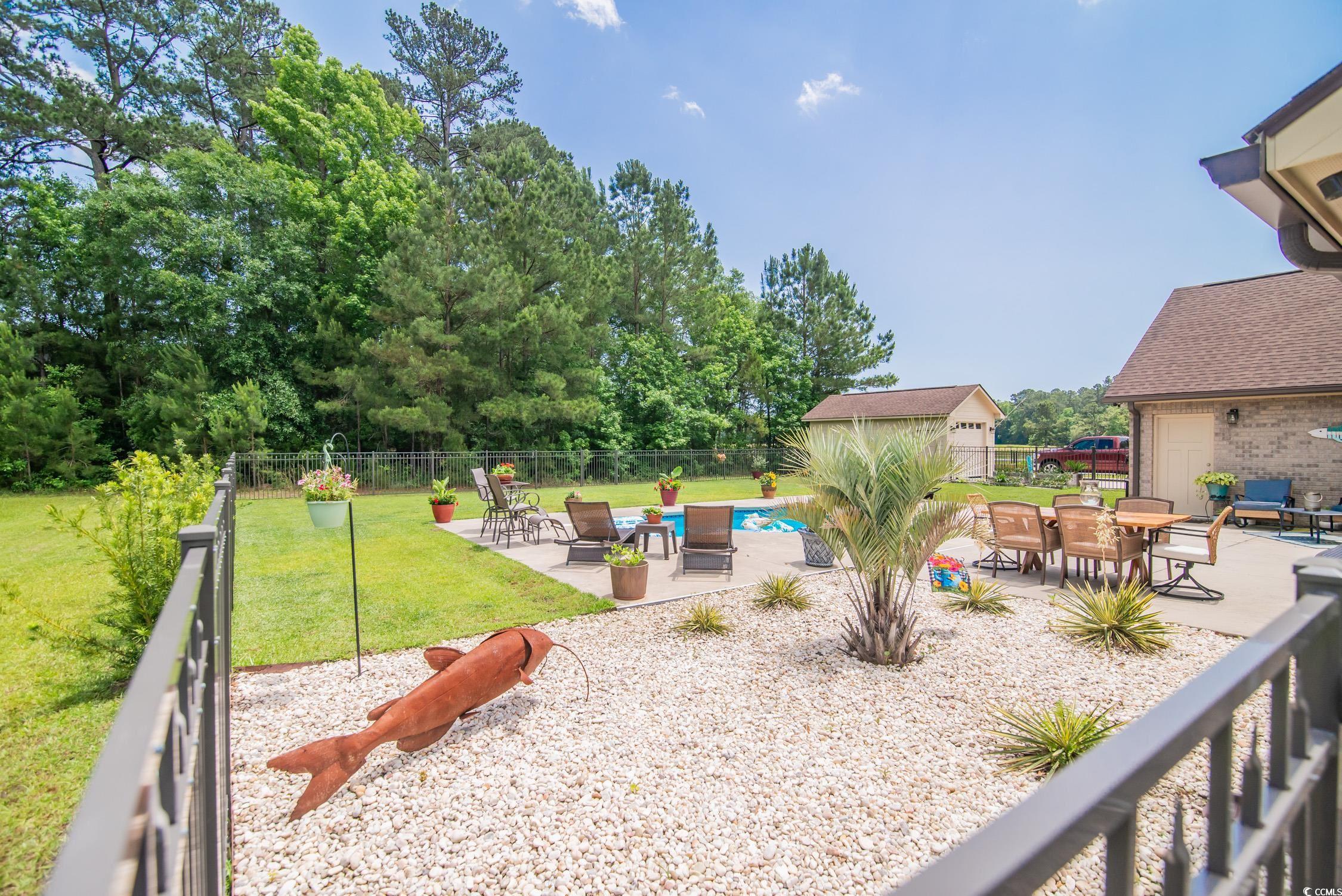 193 Field Loop Road Georgetown, SC 29440 - Photo 29 of 40 View of yard with a patio area, an outdoor structu