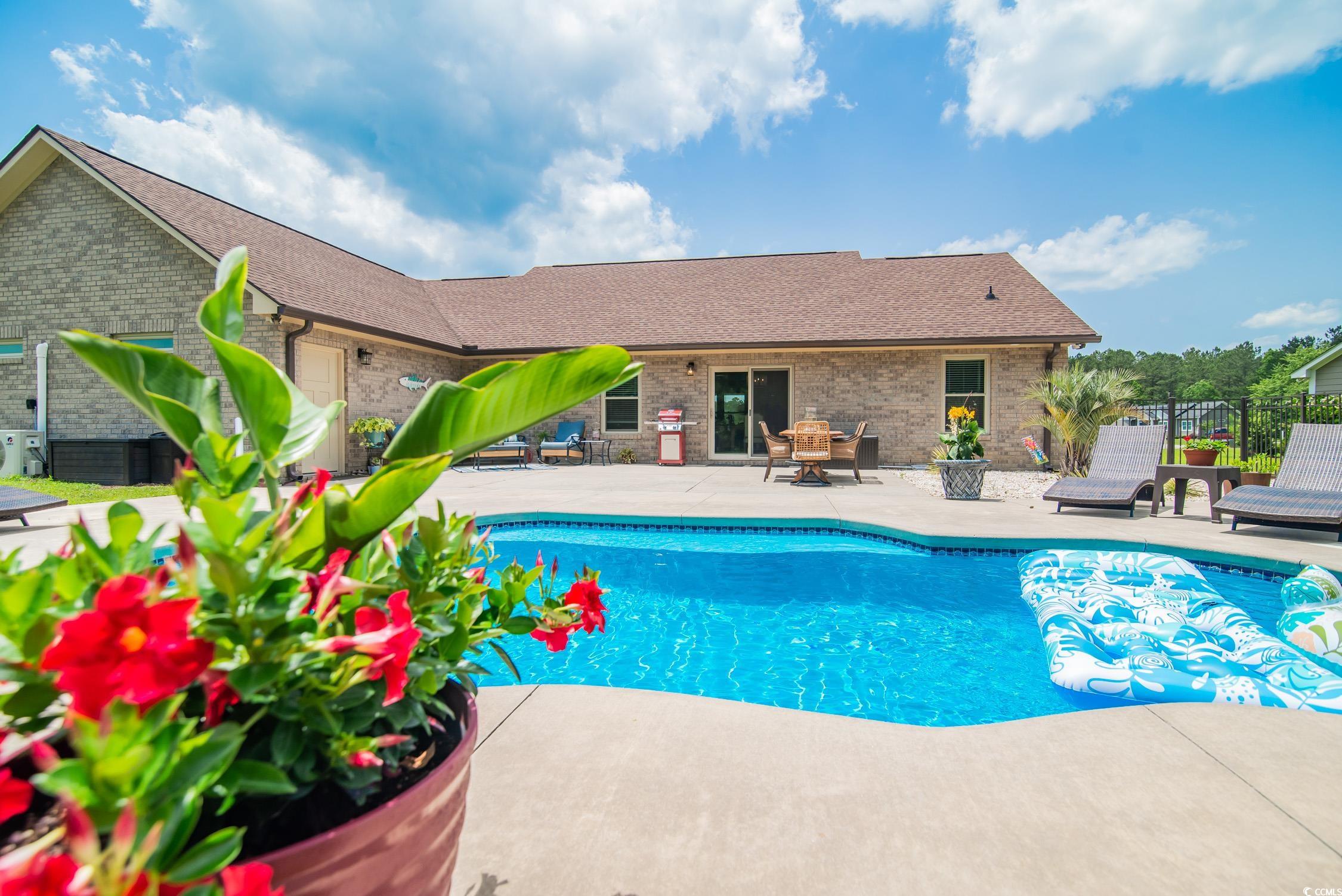 193 Field Loop Road Georgetown, SC 29440 - Photo 30 of 40 Swimming pool with a patio and fence