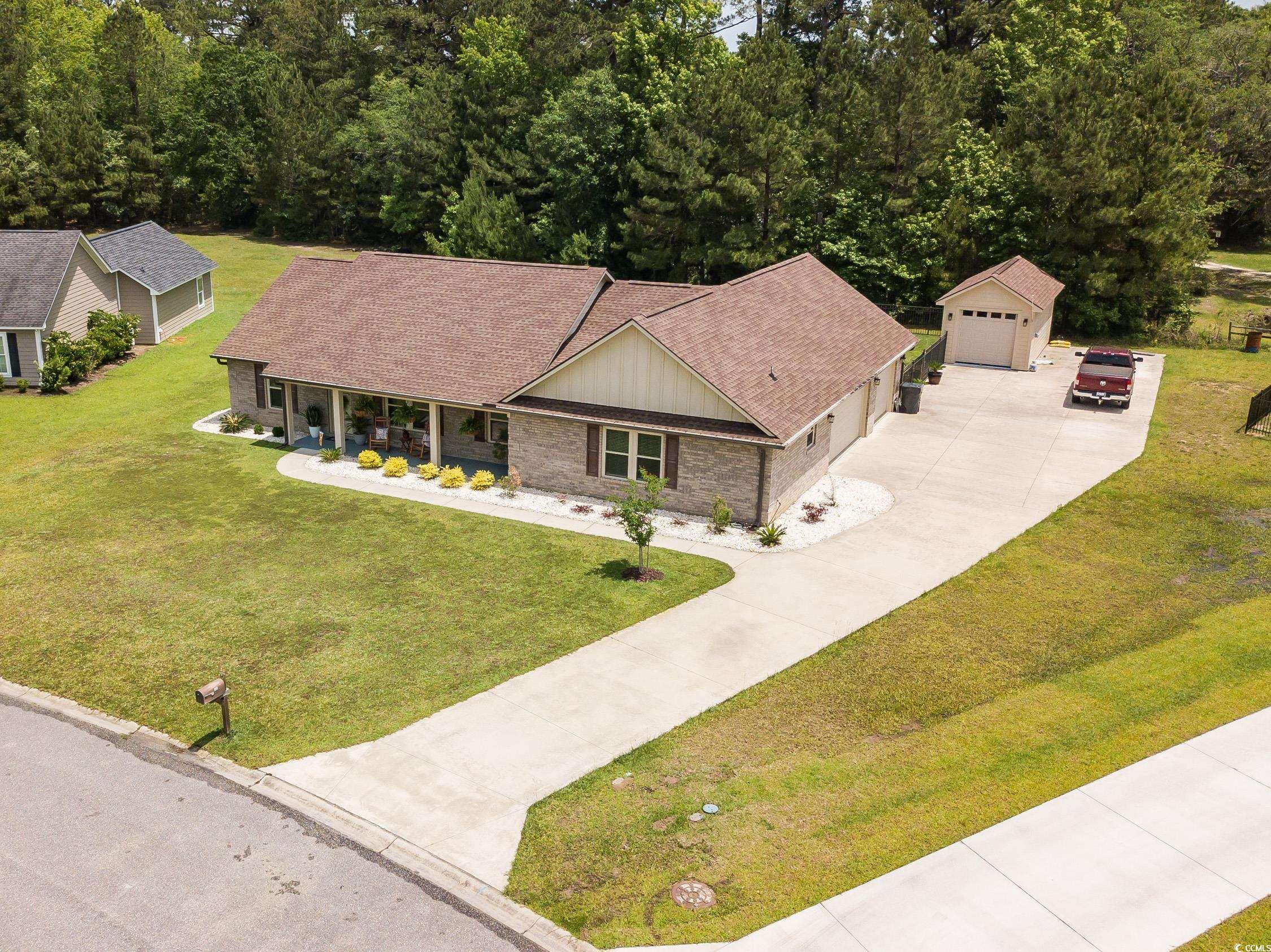 193 Field Loop Road Georgetown, SC 29440 - Photo 32 of 40 View of front of home with concrete driveway, an o