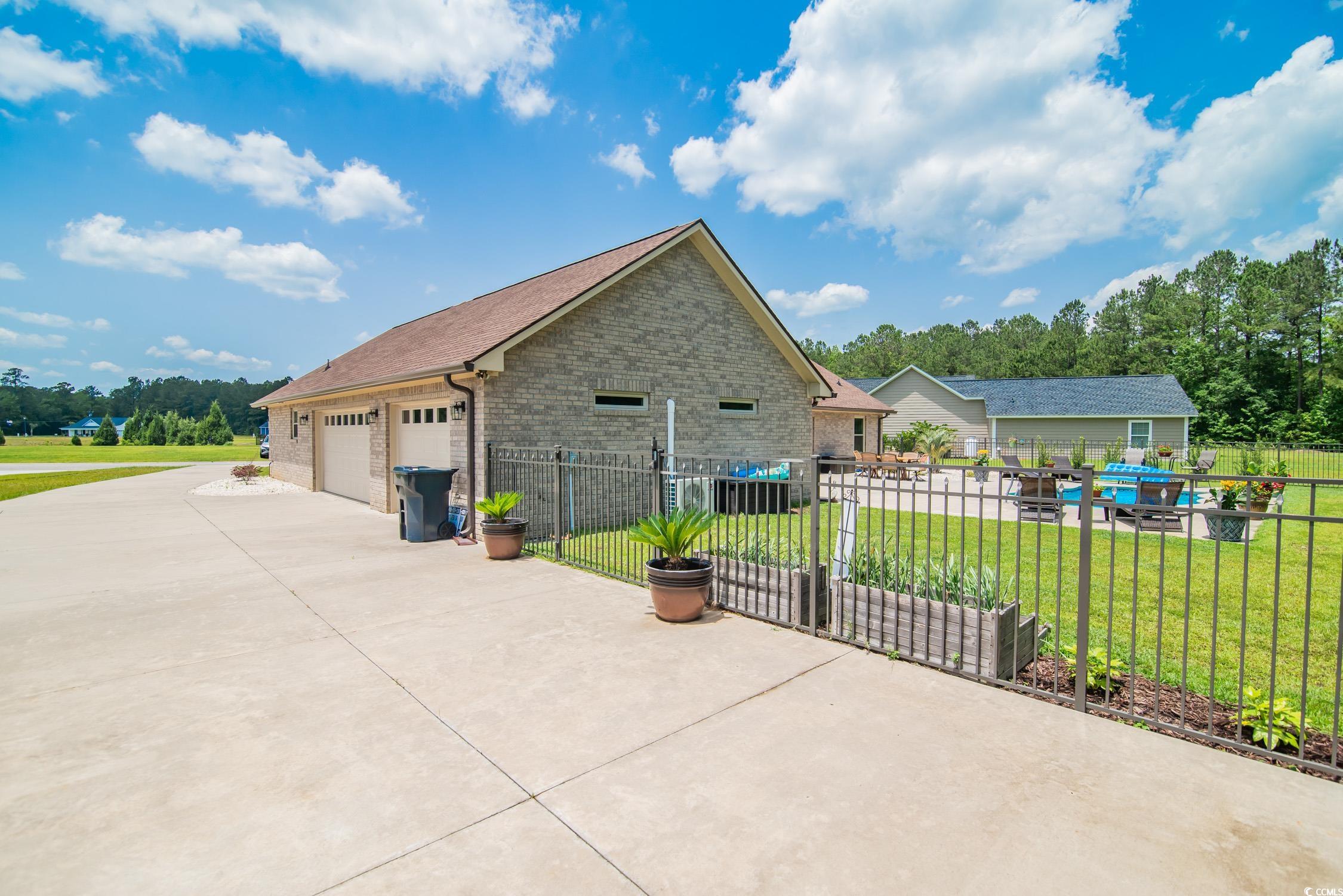 193 Field Loop Road Georgetown, SC 29440 - Photo 34 of 40 View of home's exterior featuring brick siding and