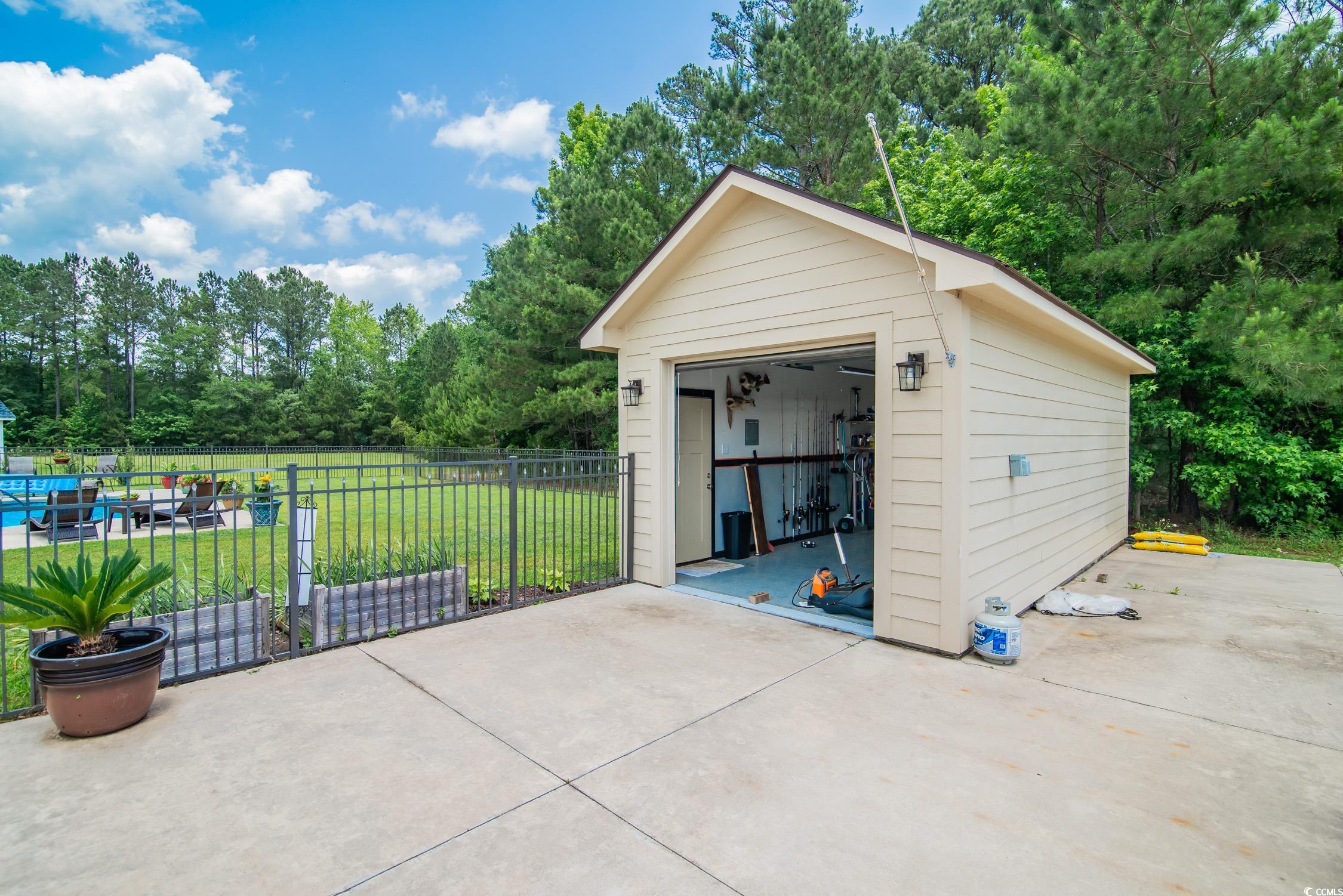 193 Field Loop Road Georgetown, SC 29440 - Photo 35 of 40 Garage with view of scattered trees