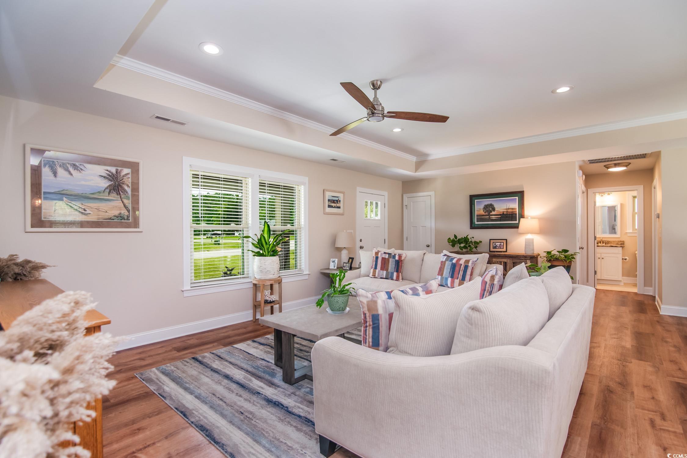 193 Field Loop Road Georgetown, SC 29440 - Photo 7 of 40 Living room featuring ornamental molding, a raised