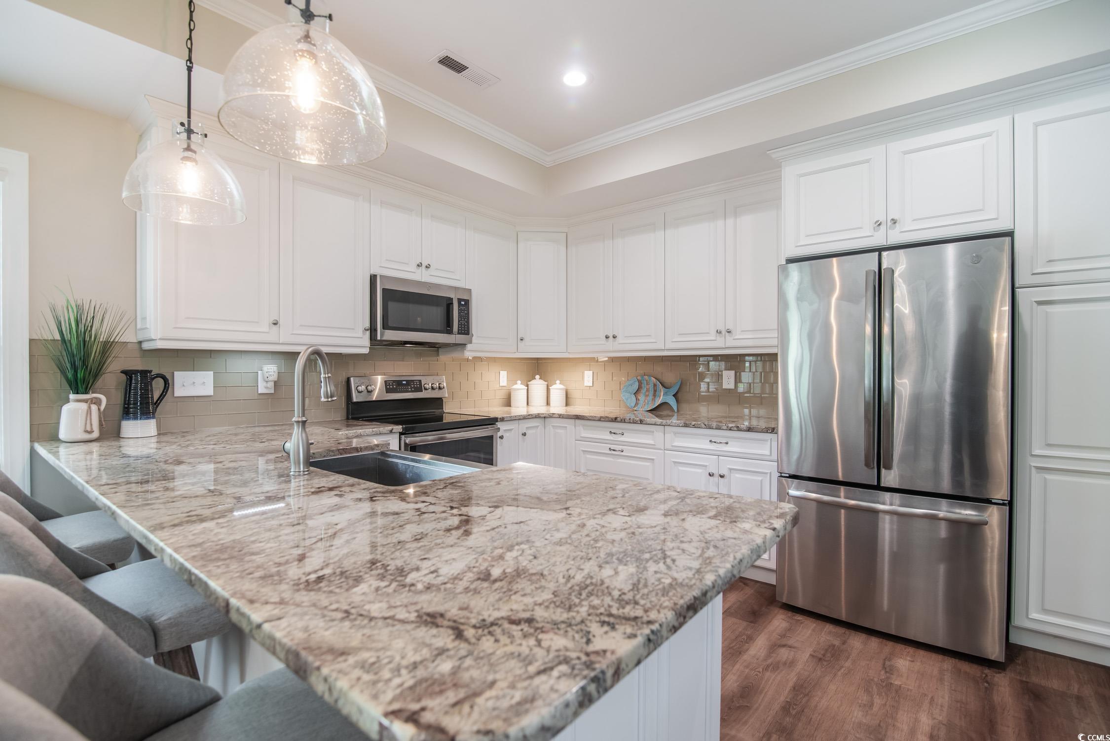 193 Field Loop Road Georgetown, SC 29440 - Photo 10 of 40 Kitchen with stainless steel appliances, a sink, w