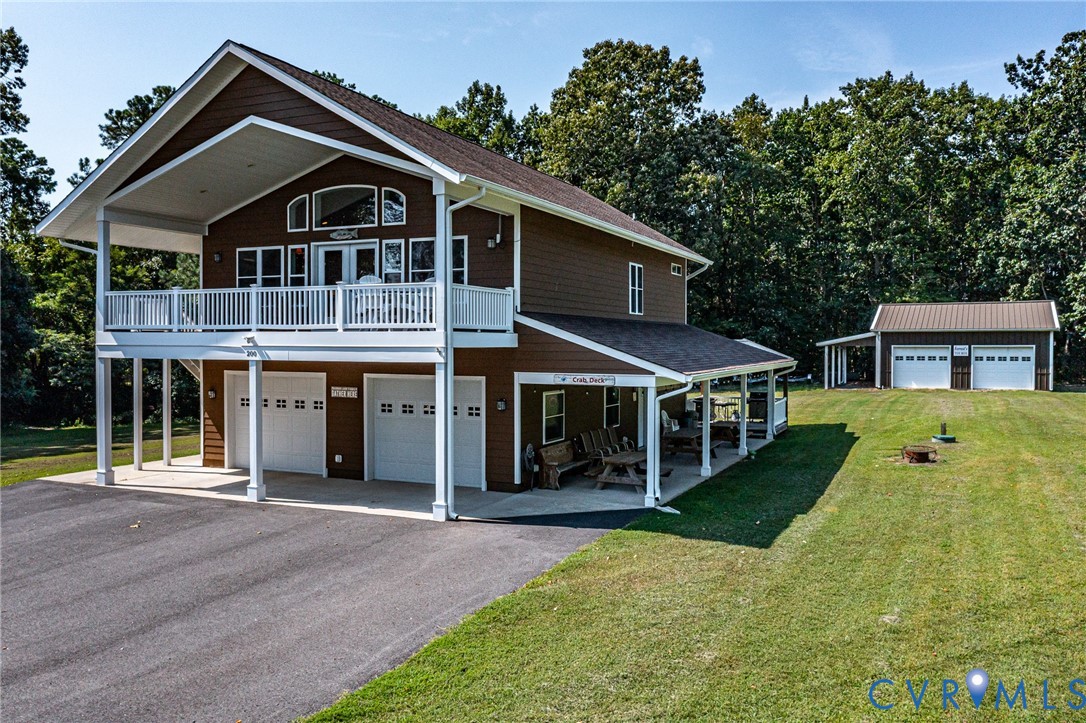 200 Pinetop Road Topping, VA 23169 - Photo 1 of 38 View of front of home with driveway, a front lawn,