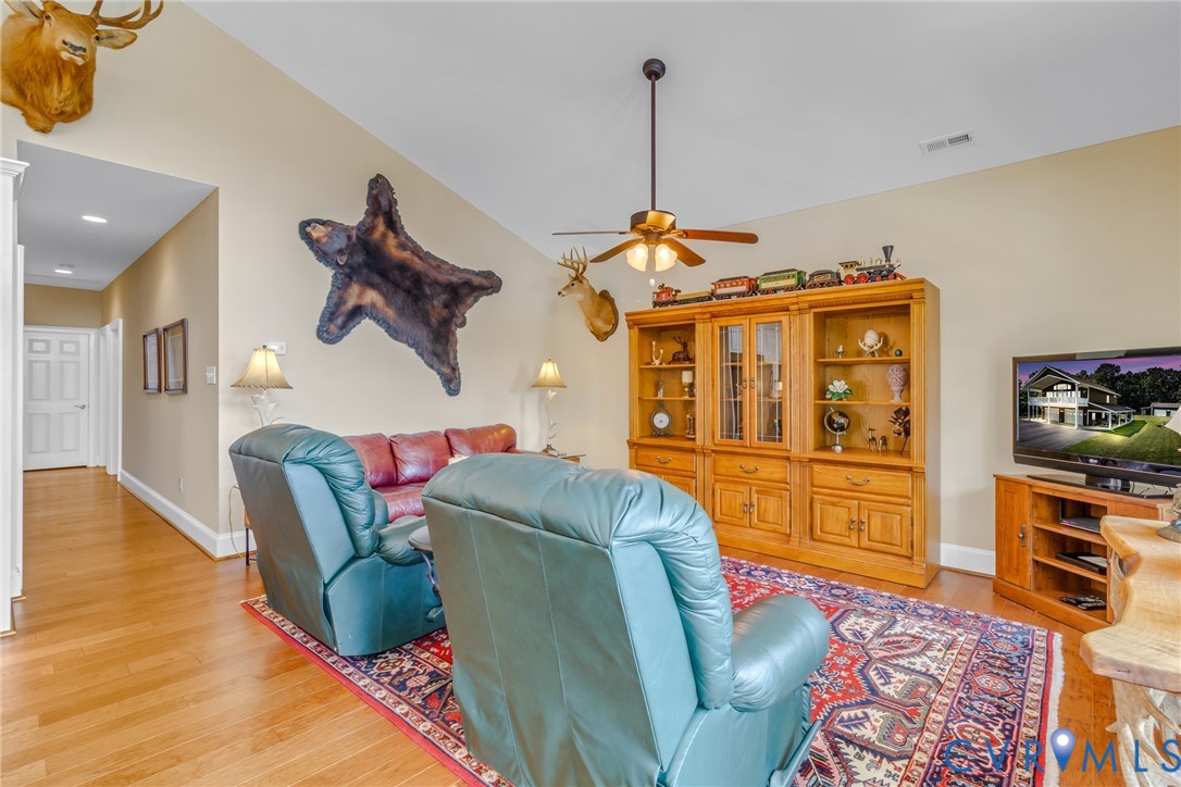 200 Pinetop Road Topping, VA 23169 - Photo 11 of 38 Living area with light wood-type flooring, ceiling