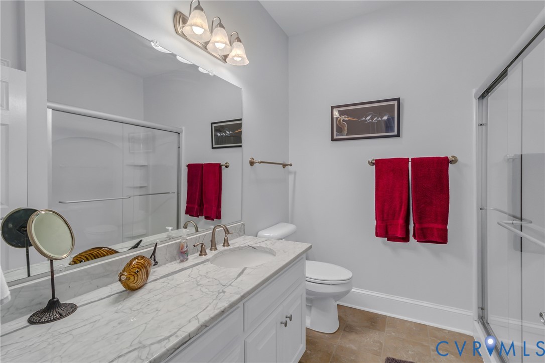 200 Pinetop Road Topping, VA 23169 - Photo 20 of 38 Full bathroom with vanity and a shower stall