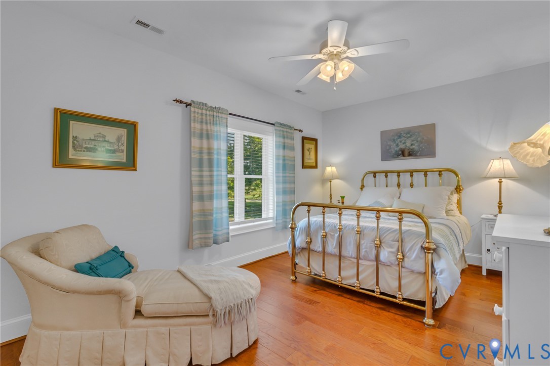 200 Pinetop Road Topping, VA 23169 - Photo 21 of 38 Bedroom with light wood-style floors and ceiling f