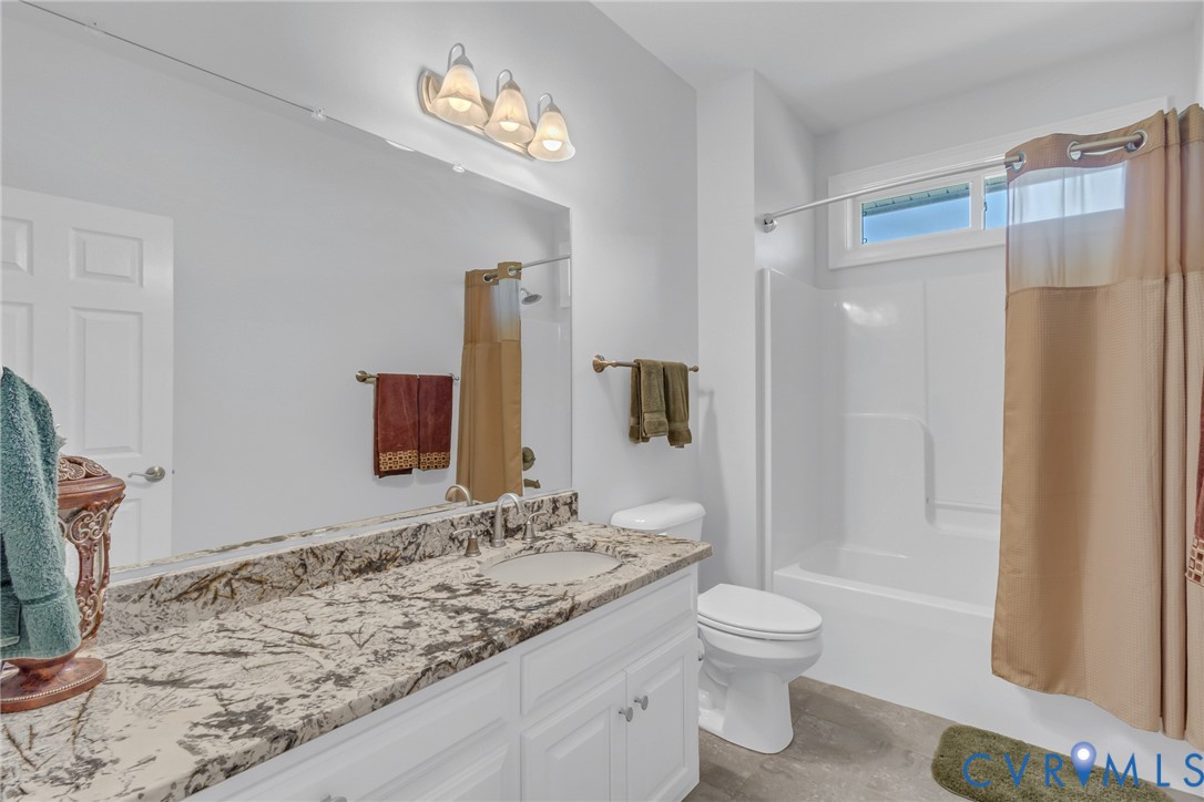 200 Pinetop Road Topping, VA 23169 - Photo 22 of 38 Bathroom featuring vanity and shower / tub combo w