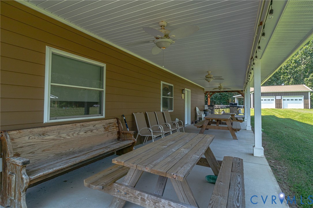 200 Pinetop Road Topping, VA 23169 - Photo 23 of 38 View of patio / terrace featuring outdoor dining s