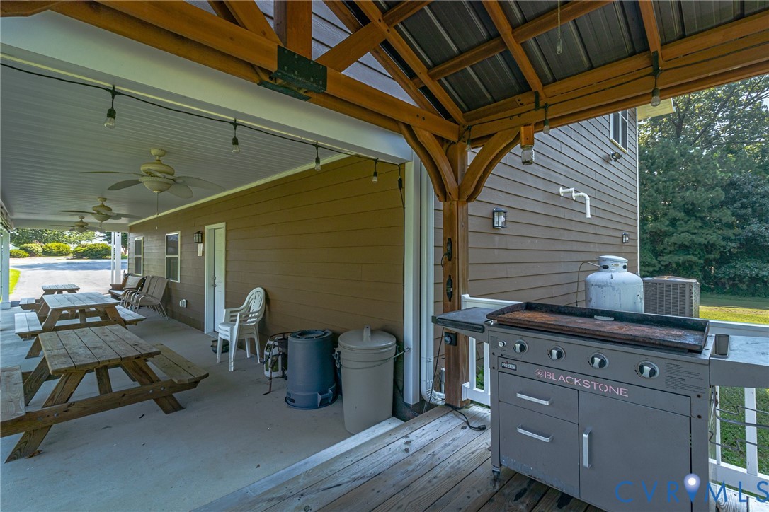 200 Pinetop Road Topping, VA 23169 - Photo 24 of 38 Wooden deck featuring ceiling fan