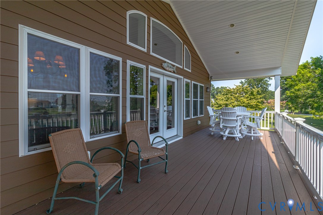 200 Pinetop Road Topping, VA 23169 - Photo 8 of 38 Wooden terrace with outdoor dining space and frenc
