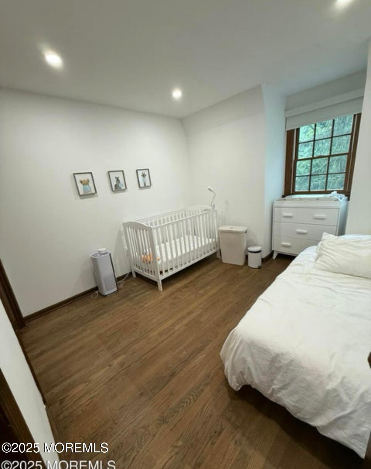 530 Wall Street Eatontown, NJ 07724 - Photo 11 of 13 a bedroom with a bed and window