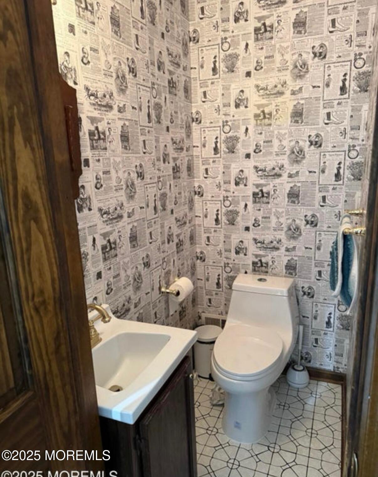 530 Wall Street Eatontown, NJ 07724 - Photo 12 of 13 a bathroom with a toilet and a sink