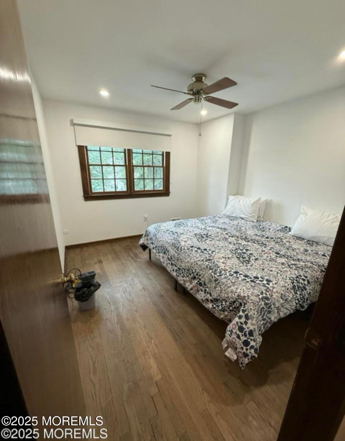 530 Wall Street Eatontown, NJ 07724 - Photo 10 of 13 a bedroom with a bed dresser and a window