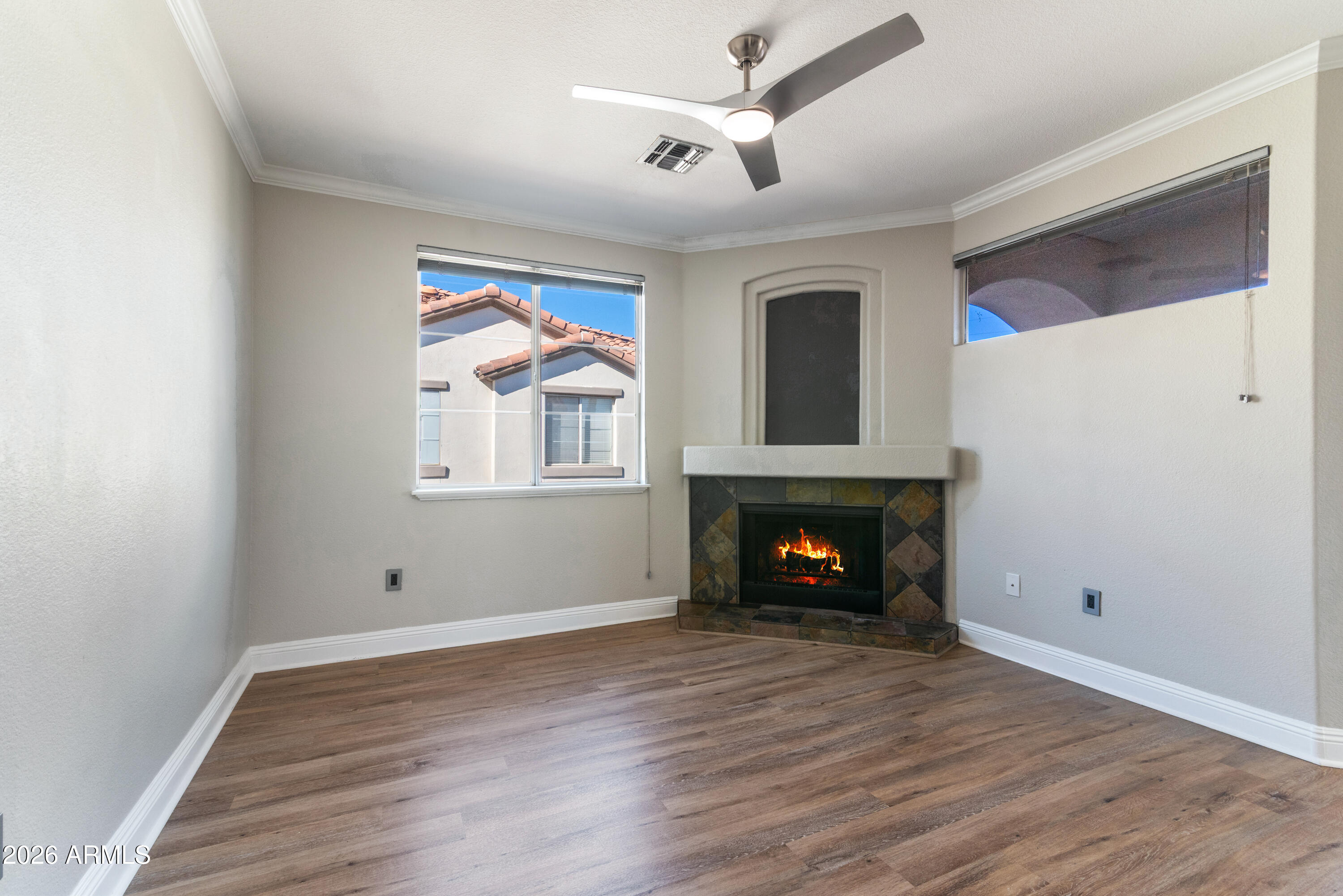 2992 North Miller Road, Unit A212 Scottsdale, AZ 85251 - Photo 3 of 25 Living Room with wood burning fireplace