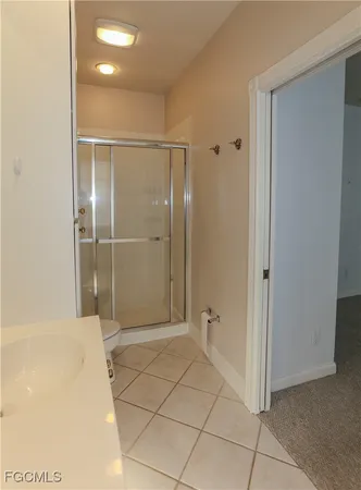 a bathroom with a shower and a sink