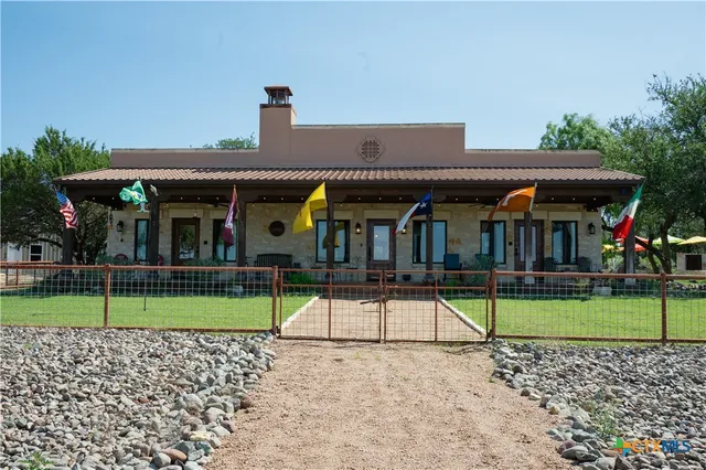 a view of house with a yard