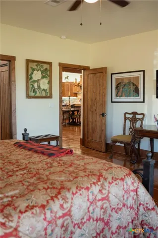 a bedroom with furniture and window