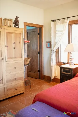 a bedroom with a bed and a closet