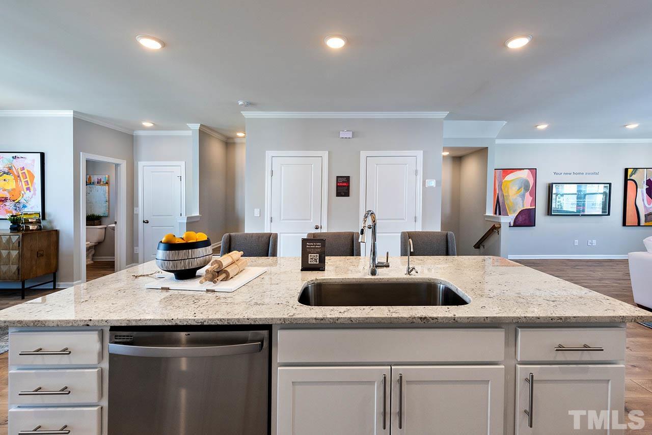 7016 Bent Pine Place, Unit 34 Raleigh, NC 27613 - Photo 21 of 24 a kitchen with sink and white cabinets