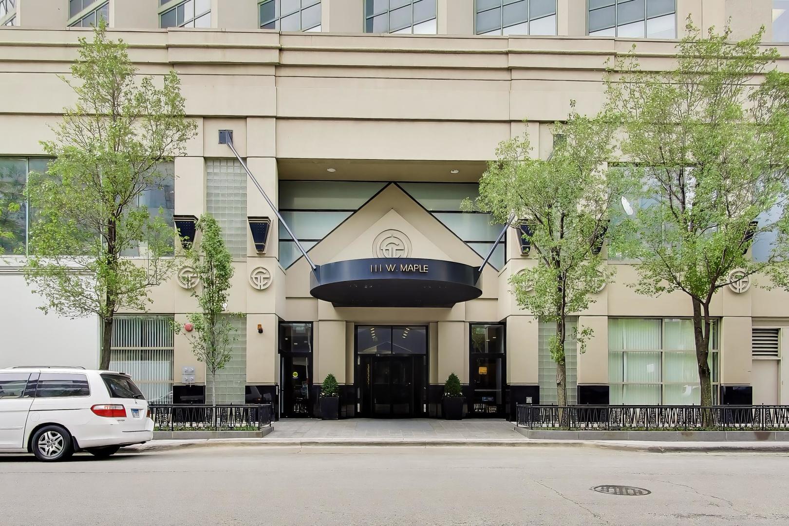 111 West Maple Street, Unit 1503 Chicago, IL 60610 - Photo 3 of 39 a view of a car park in front of a building