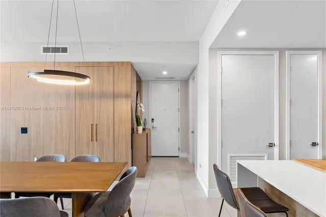 a lobby with furniture and floor to ceiling window