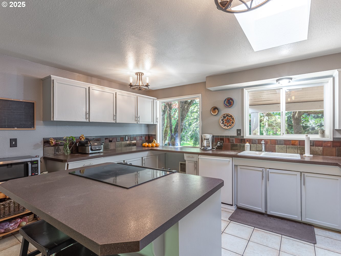 50010 Southeast Coalman Road Sandy, OR 97055 - Photo 14 of 48 a kitchen with a stove a sink a window and dining table