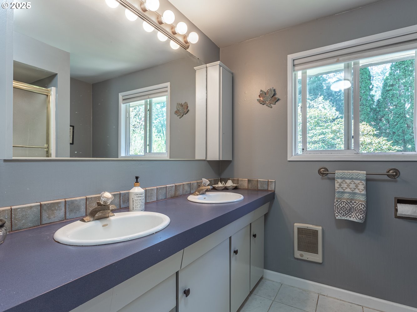 50010 Southeast Coalman Road Sandy, OR 97055 - Photo 28 of 48 a bathroom with double vanity sinks a mirror and a window