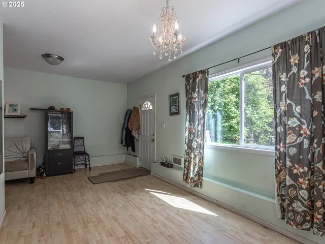 a view of livingroom with hardwood floor and a ceiling fan