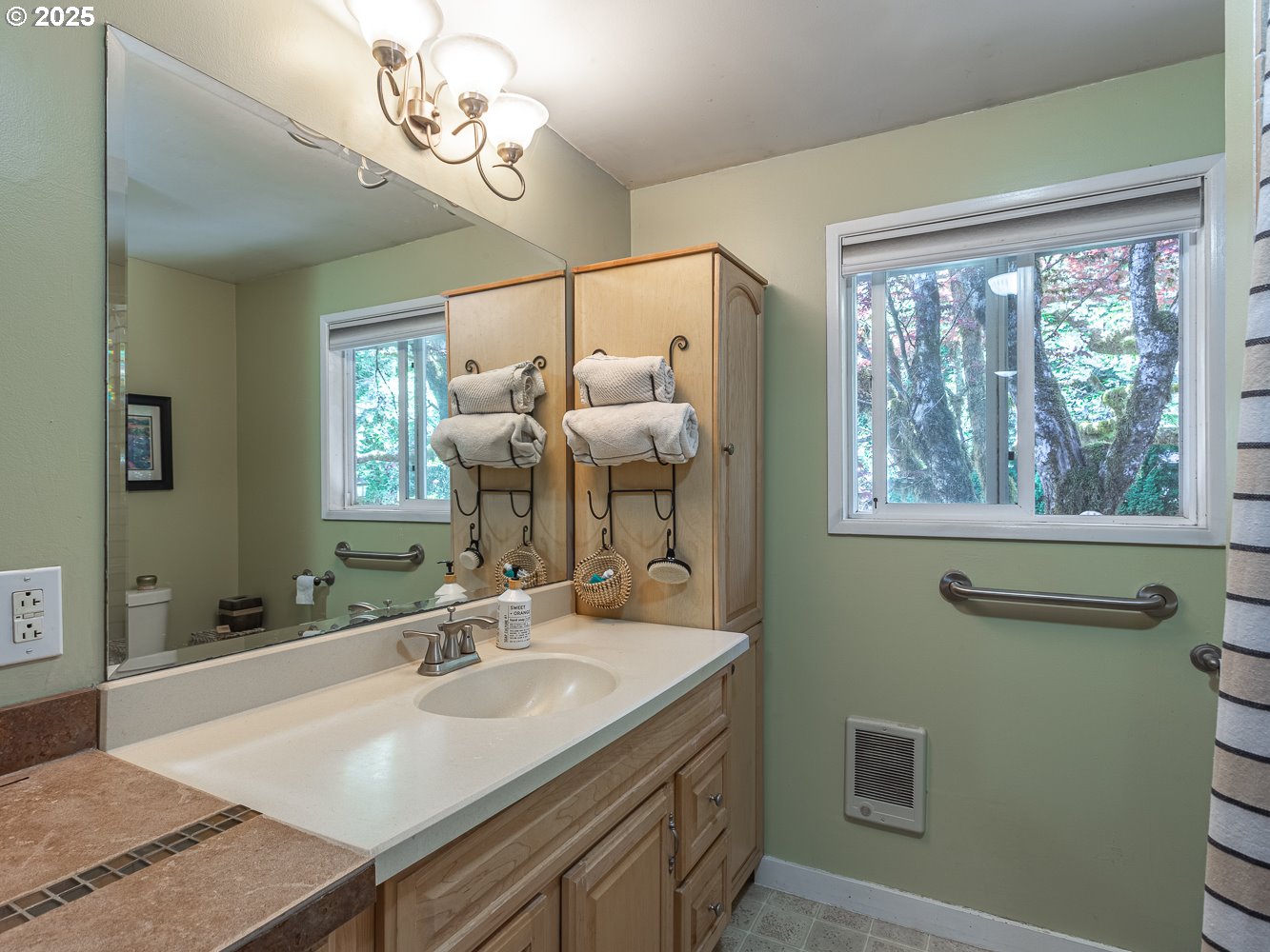 50010 Southeast Coalman Road Sandy, OR 97055 - Photo 32 of 48 a bathroom with a sink a large mirror and a window