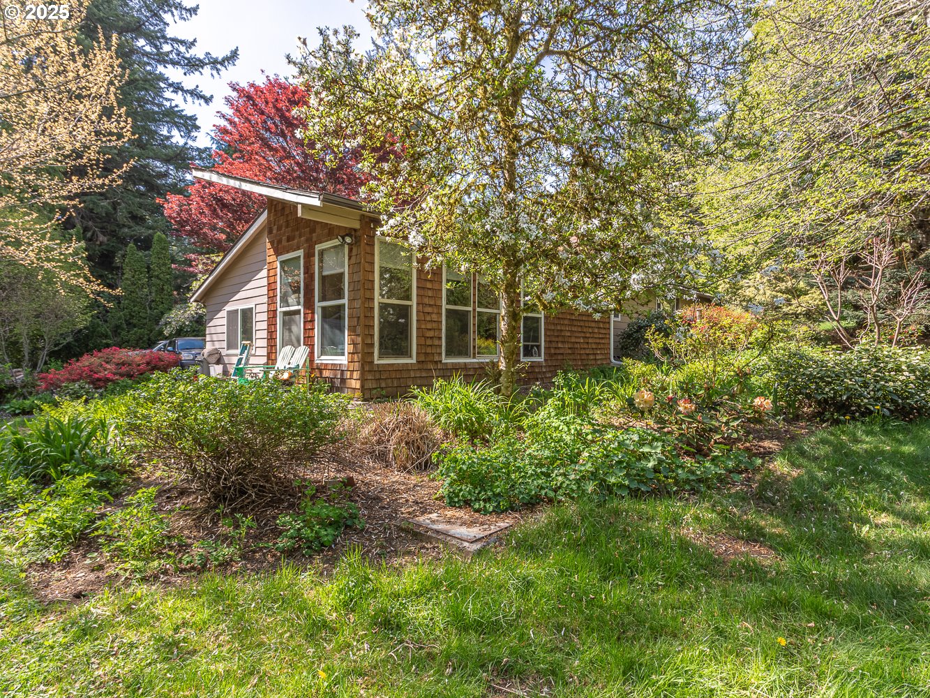 50010 Southeast Coalman Road Sandy, OR 97055 - Photo 35 of 48 a front view of a house with garden