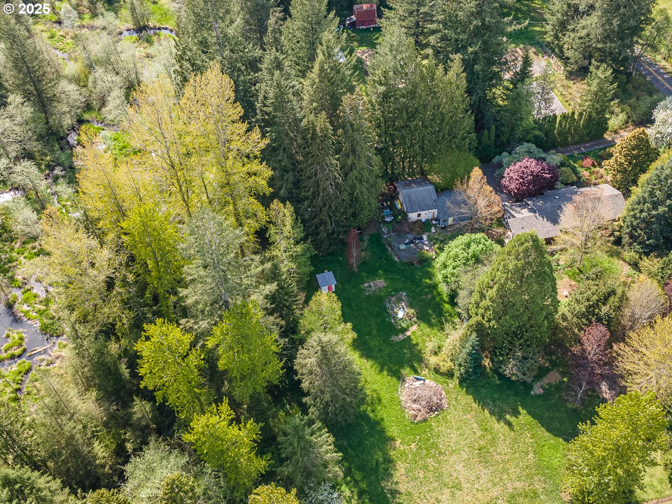 50010 Southeast Coalman Road Sandy, OR 97055 - Photo 43 of 48 a backyard of a house with a yard and outdoor seating