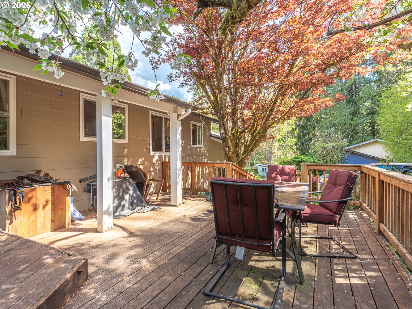 50010 Southeast Coalman Road Sandy, OR 97055 - Photo 7 of 48 a view of a patio with table and chairs and wooden floor