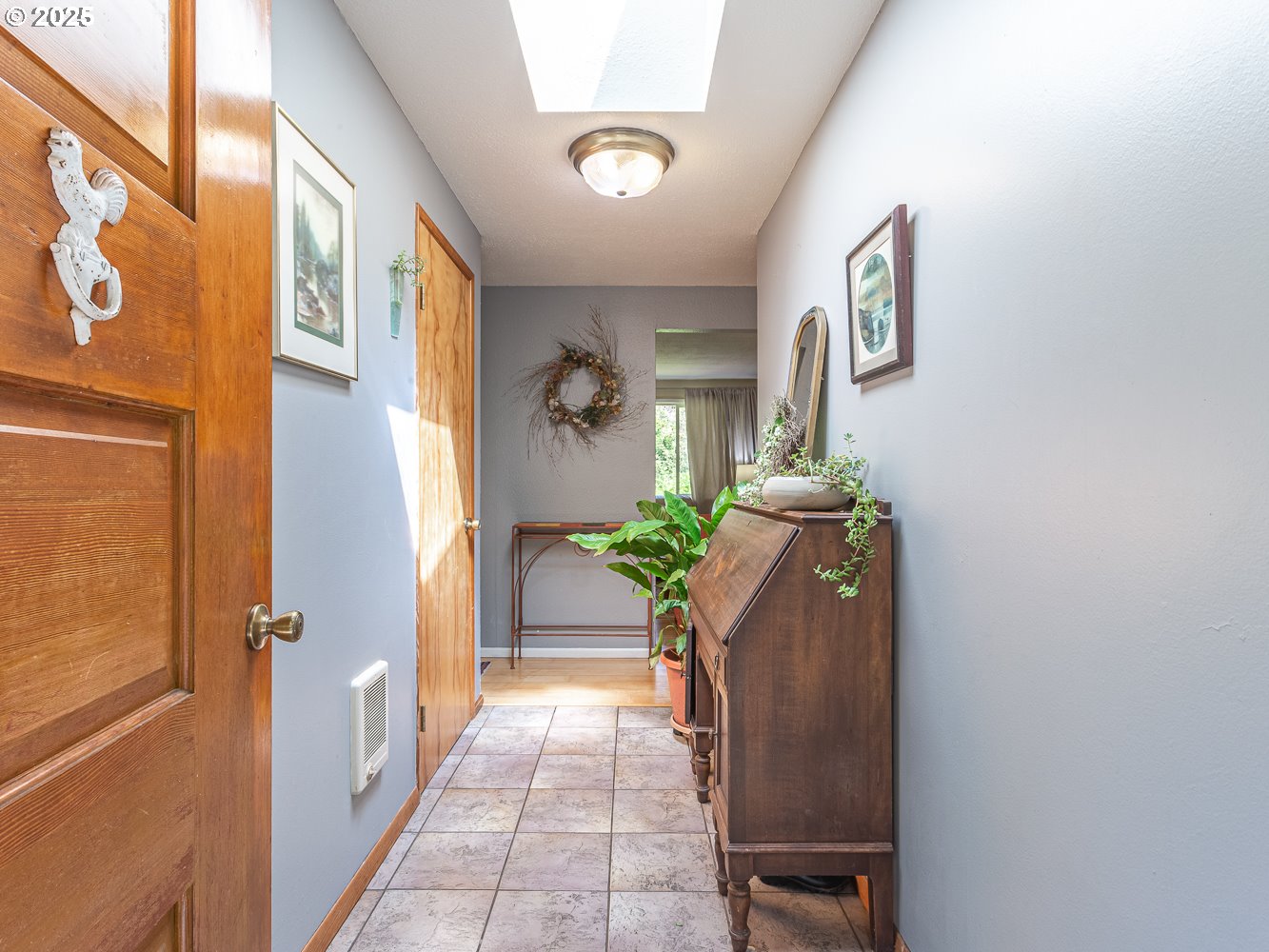 50010 Southeast Coalman Road Sandy, OR 97055 - Photo 9 of 48 a hallway with painting and a potted plant