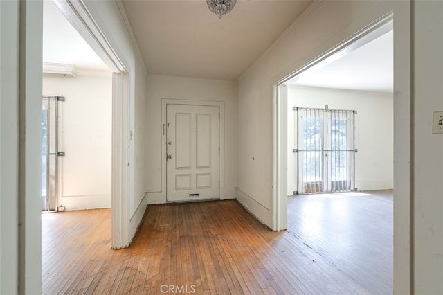 wooden floor in an empty room and a window