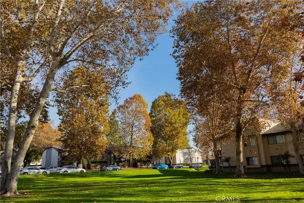 a view of a house with sitting area and garden