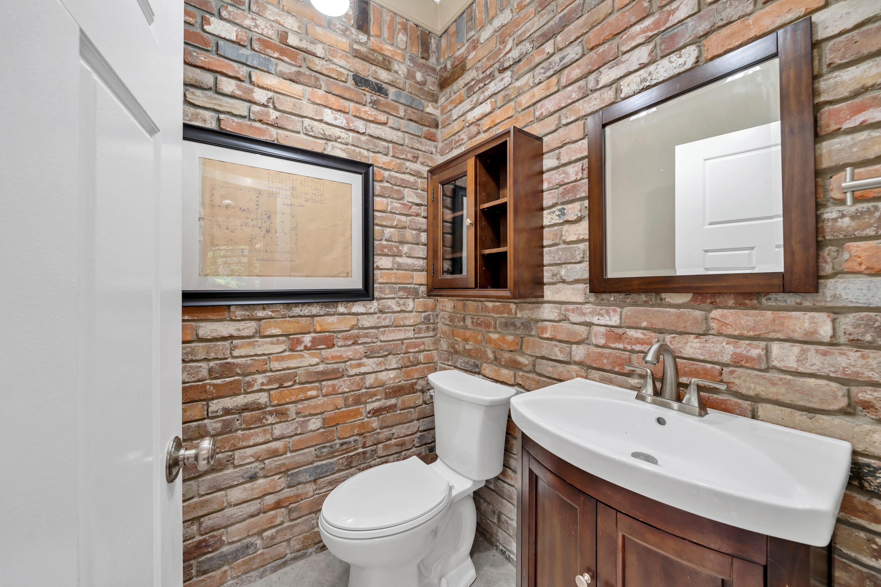 4 Roundabend Road Shalimar, FL 32579 - Photo 13 of 36 a bathroom with a toilet sink and mirror