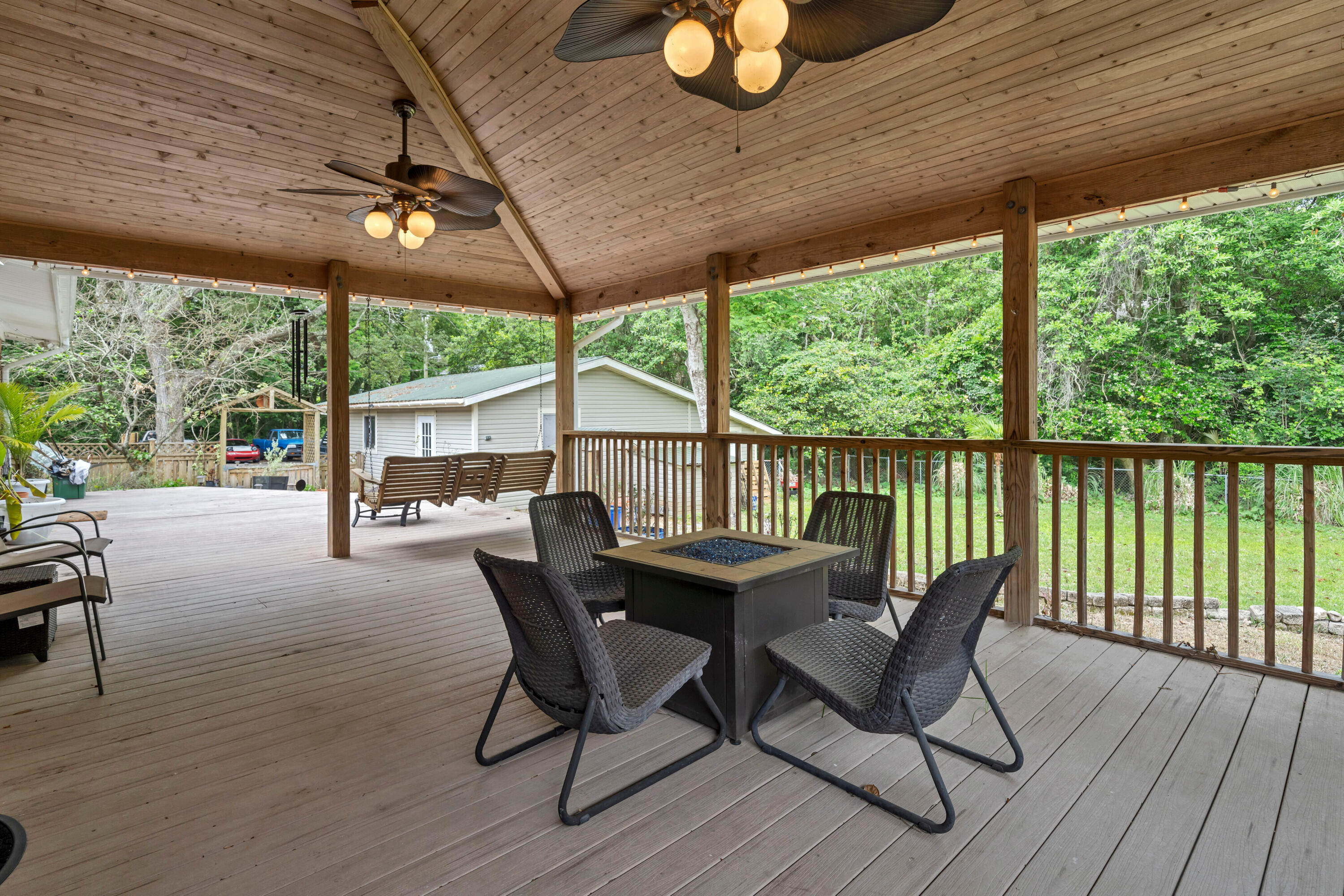 4 Roundabend Road Shalimar, FL 32579 - Photo 16 of 36 a view of a patio with a table chairs and a patio