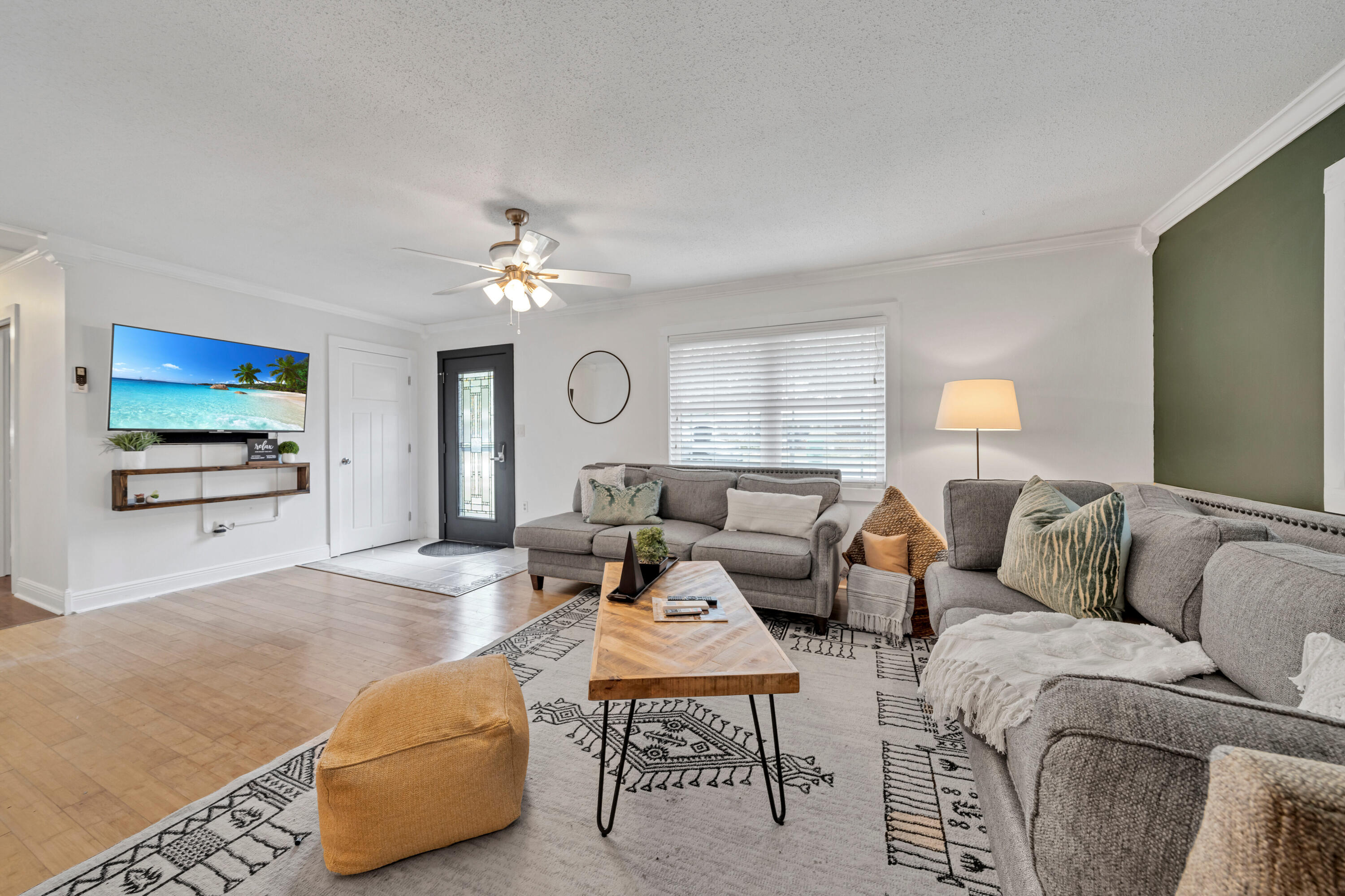 4 Roundabend Road Shalimar, FL 32579 - Photo 29 of 36 a living room with furniture and a chandelier