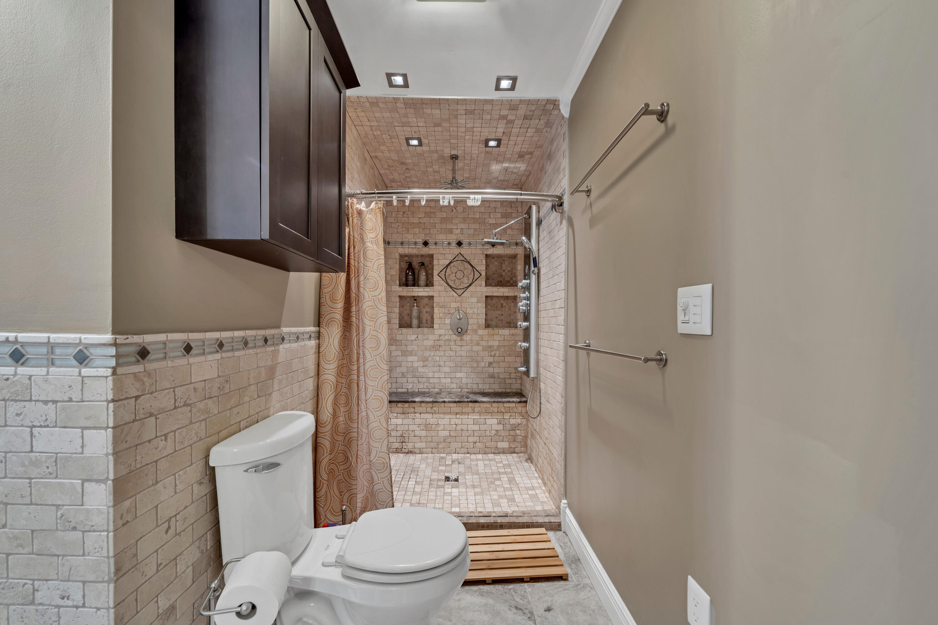 4 Roundabend Road Shalimar, FL 32579 - Photo 3 of 36 a bathroom with a granite countertop toilet a mirror and shower