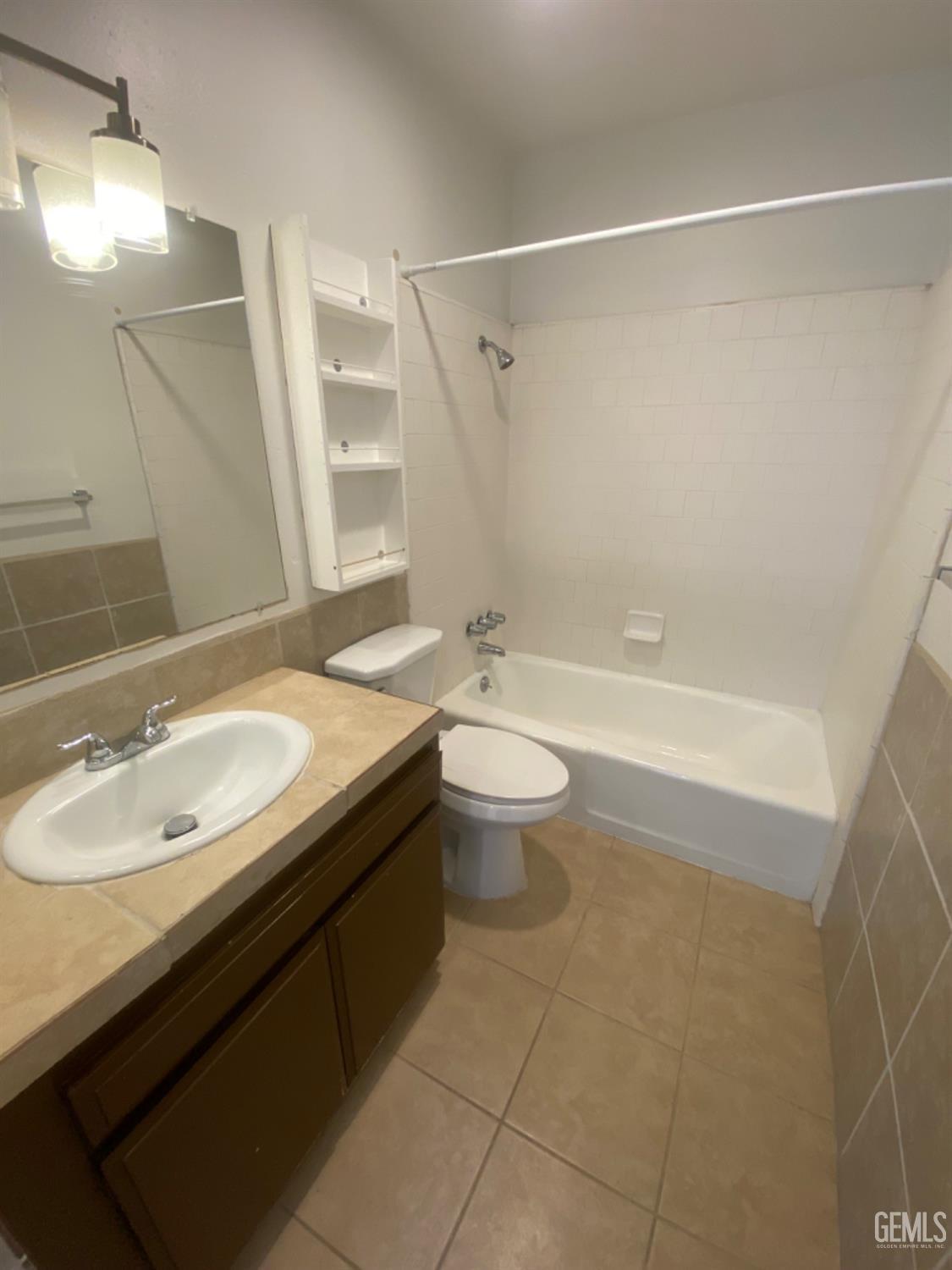 Undisclosed Address Bakersfield, CA 93309 - Photo 19 of 31 a bathroom with a sink a toilet and shower
