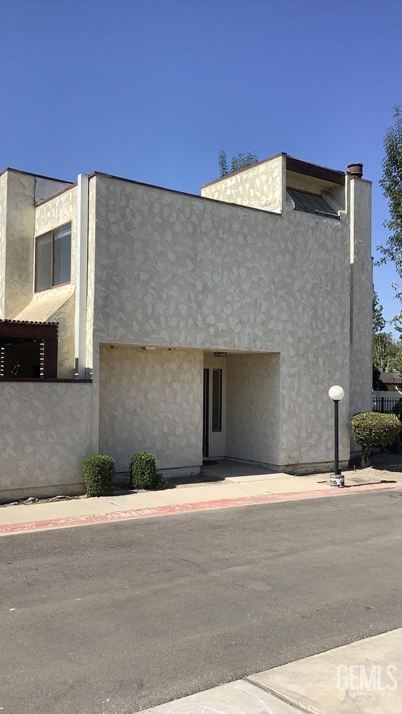 Undisclosed Address Bakersfield, CA 93309 - Photo 2 of 31 a front view of a house with a yard
