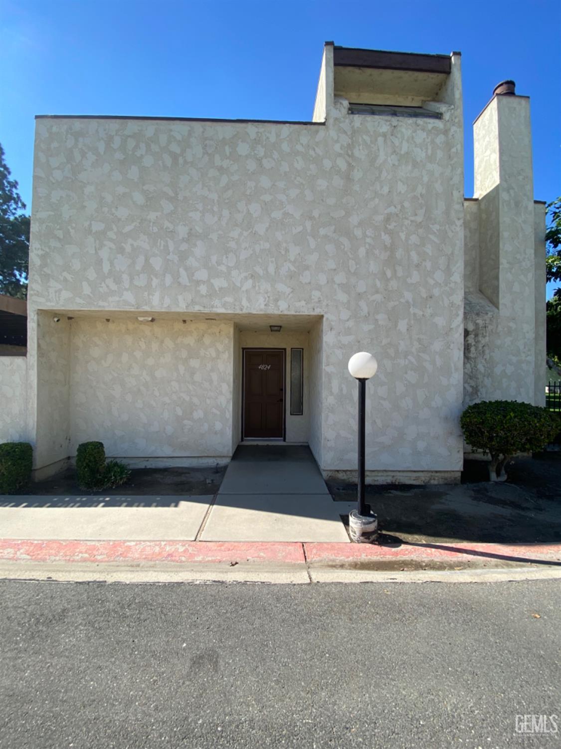 Undisclosed Address Bakersfield, CA 93309 - Photo 3 of 31 a front view of a house with a yard