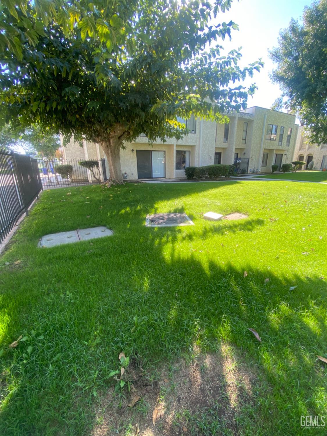 Undisclosed Address Bakersfield, CA 93309 - Photo 31 of 31 a view of a house with a big yard next to a big yard