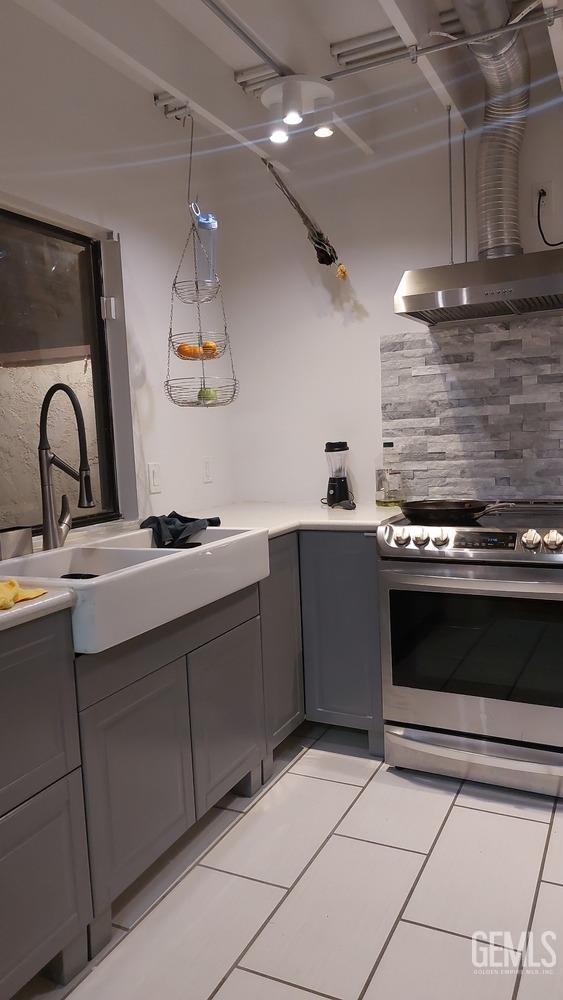 Undisclosed Address Bakersfield, CA 93309 - Photo 6 of 31 a kitchen with a sink and a stove top oven
