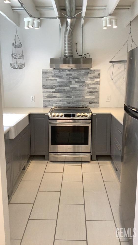 Undisclosed Address Bakersfield, CA 93309 - Photo 7 of 31 a kitchen with granite countertop a stove a microwave and a counter top space