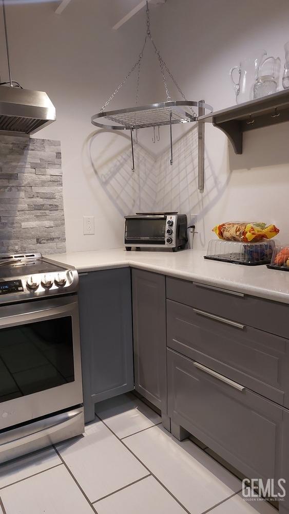 Undisclosed Address Bakersfield, CA 93309 - Photo 8 of 31 a stove top oven sitting inside of a kitchen