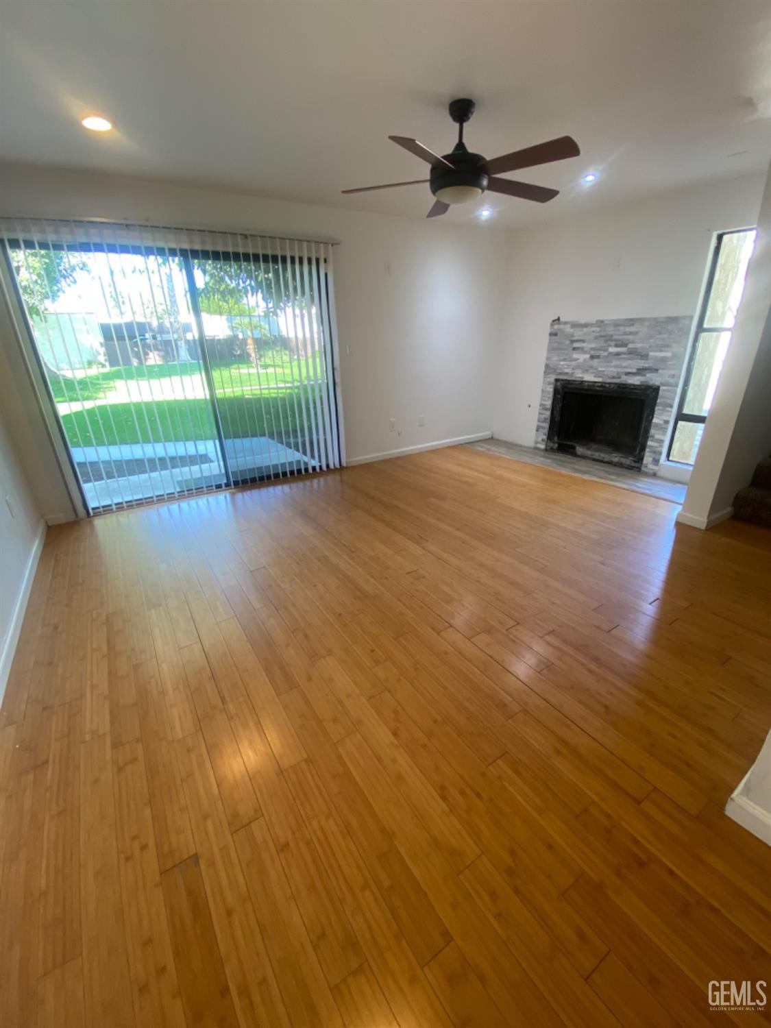 Undisclosed Address Bakersfield, CA 93309 - Photo 9 of 31 wooden floor in an empty room with a window