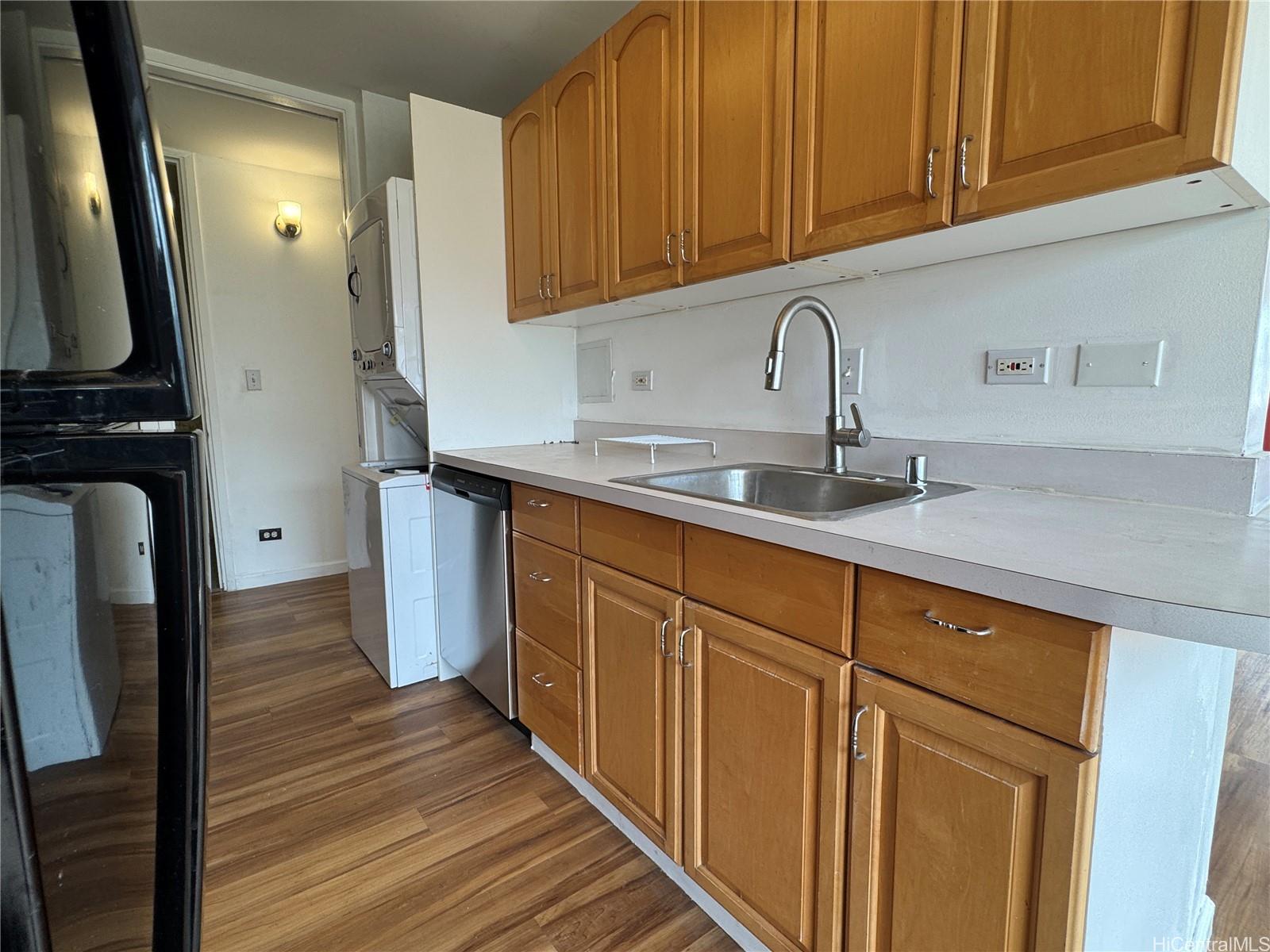 2085 Ala Wai Boulevard, Unit B94 Honolulu, HI 96815 - Photo 17 of 23 a kitchen with stainless steel appliances granite countertop a sink stove and cabinets